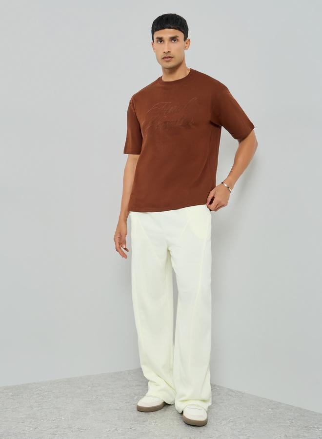 Styli Men Cream Solid Relaxed Fit Joggers - Image 1